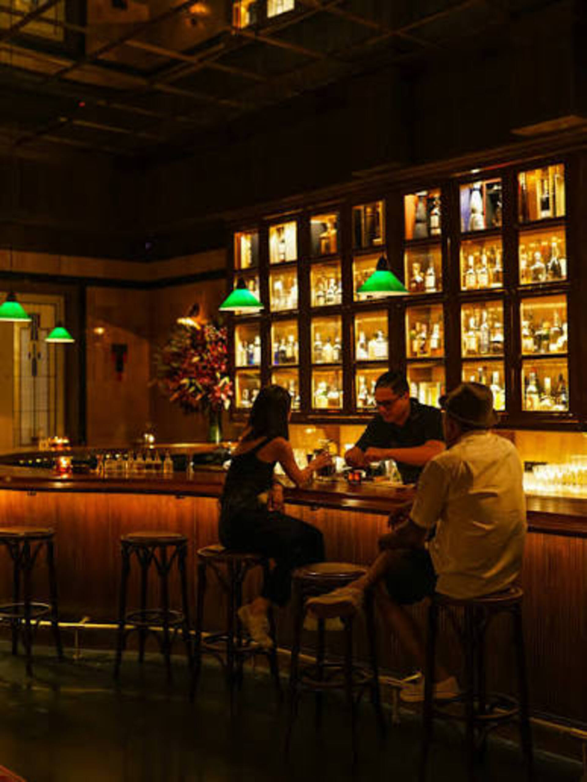 Hidden bar interior in Jakarta with speakeasy-style lighting