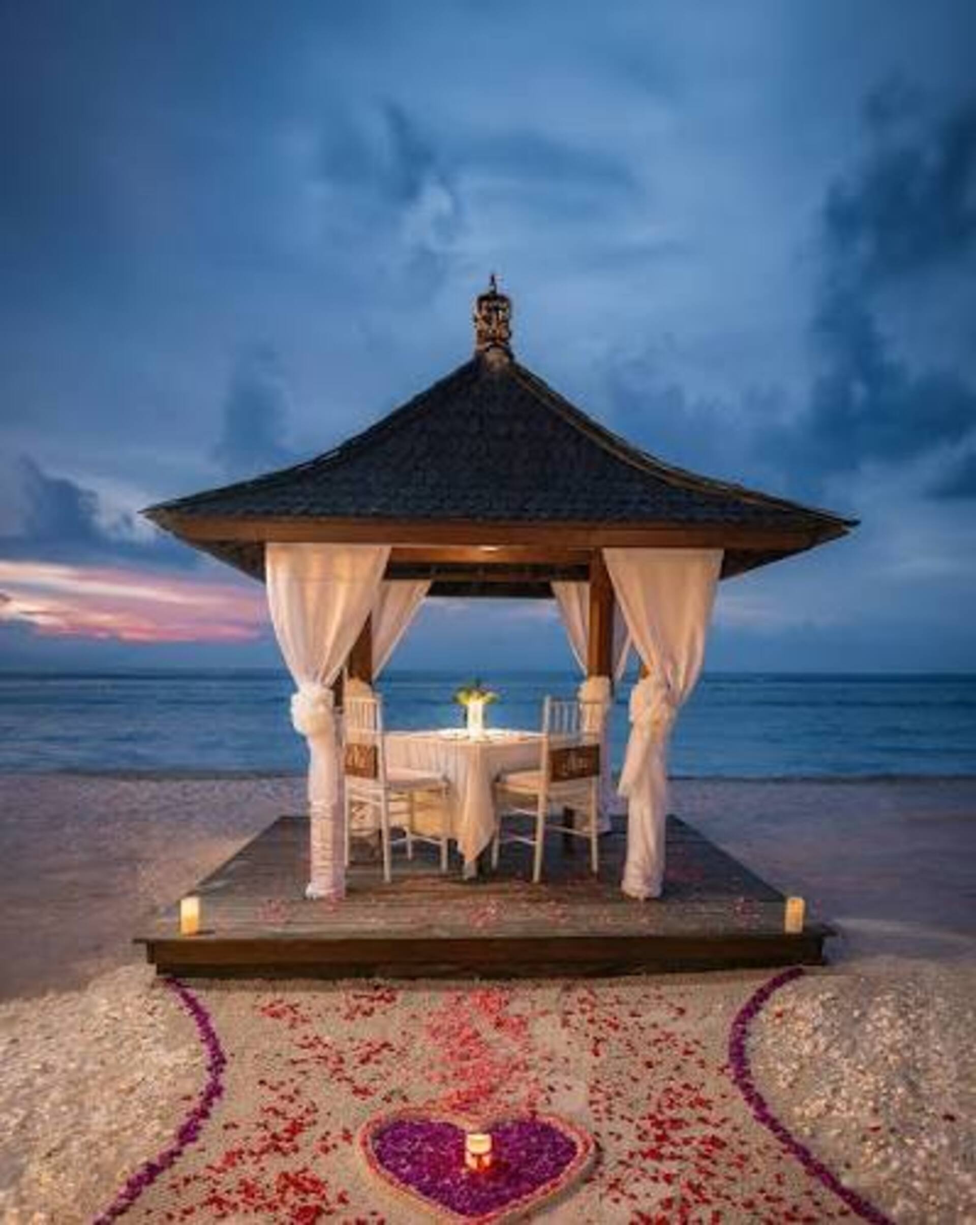 Cafe terrace overlooking the ocean at sunset in Indonesia